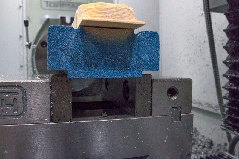 A piece of scrap wood used to help hold the pinewood derby car in place - when milling on a Tormach mill
